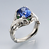 Natural blue Ceylon sapphire hand engraving with blue sapphires, emeralds, and diamonds engagement ring