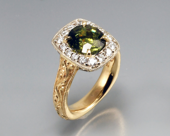 Yellow and white gold green sapphire halo setting with white diamonds intricate hand engraving engagement ring