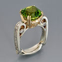 august birthstone peridot and diamond ring in white and yellow gold