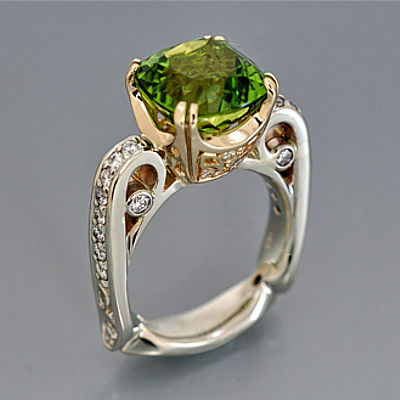 august birthstone peridot and diamond ring in white and yellow gold