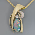 october birthstone opal and diamond pendant in white and yellow gold