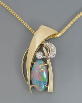 Opal in 18k white and yellow gold with diamonds